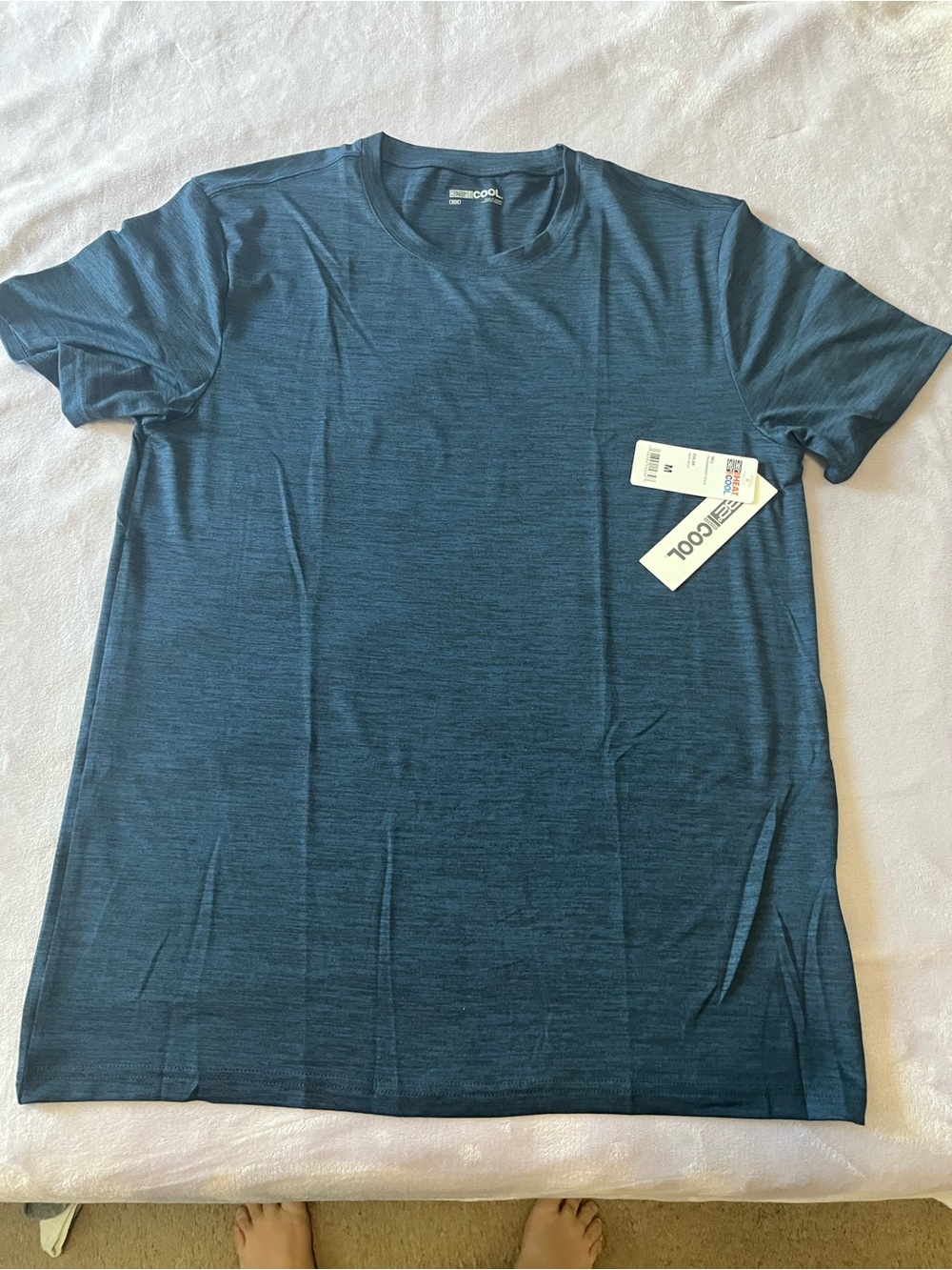 Soft  blue  short-sleeve active tee. Lightweight, breathable fabric
